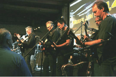 From left: Dave Dallas, Dewey Kuchle, Andre Dicaire, Mark Kennedy, Kim Michon, and Darren Eberle. Chris Martin (not visible) is on the drums.