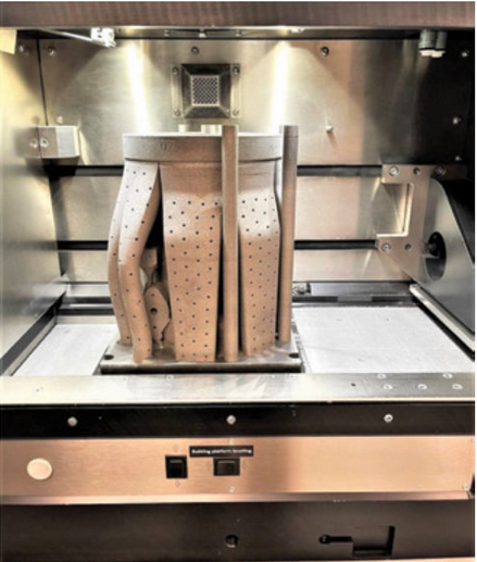 This prototype valve body was printed with hollow breakaway supports for development testing. Metal additive manufacturing allows for shorter lead times and quicker iterations during development, as compared to traditional fabrication methods. This facilitates faster overall development times and allows engineers to explore non-traditional designs.